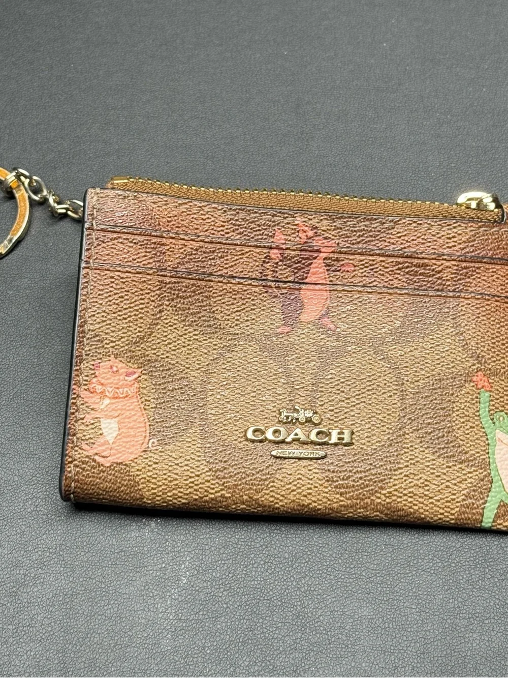 Coach Brown Signature Zip Card Case with Gold Logo and Playful Print